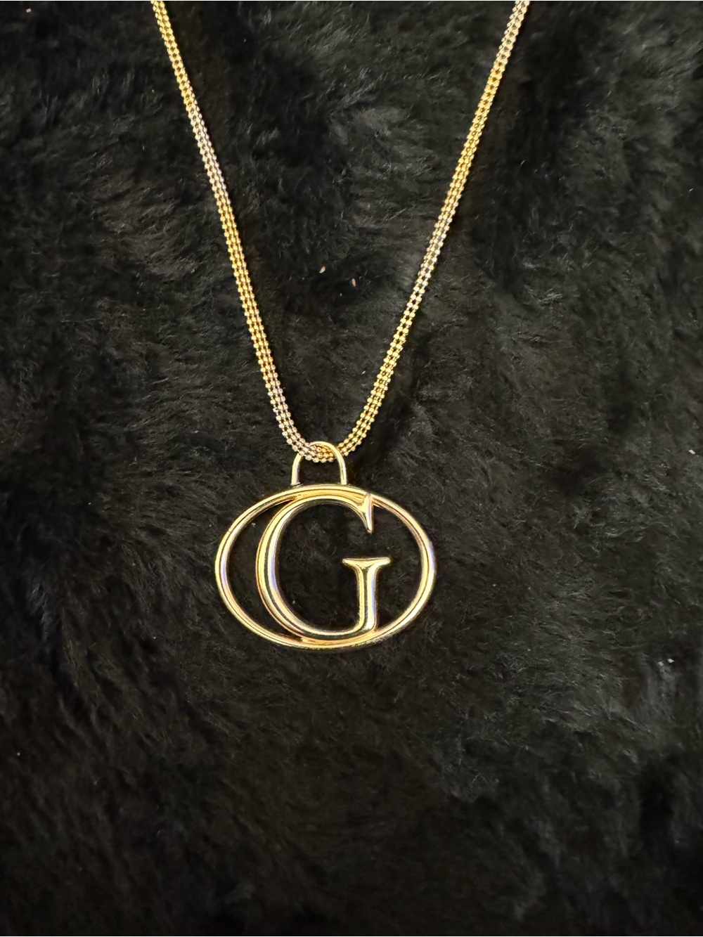 Gold toned G logo  Guess Pendant